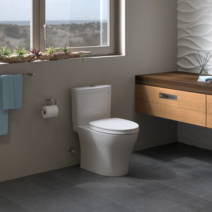 TOTO - Aquia IV, Tow piece Elongated Dual Flush Universal Height Skirted Toilet With Soft Close Seat ** PICK UP IN STORE ONLY ** - Construction Commodities Supply Inc.